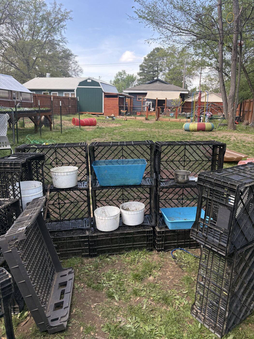 The bug hotel, built from crates in the play yard, with its rooms and water dishes