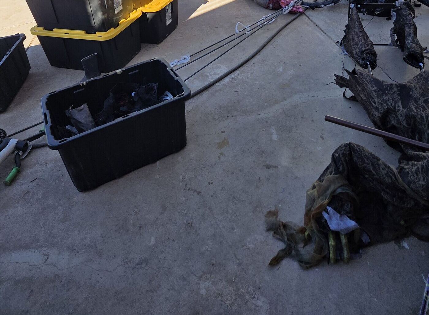 Bins of props and a giant spider packed away after the haunted path